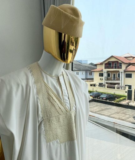 A “jakan” hand woven embroidery agbada, dashiki, sokoto with a cream wool patterned hat.