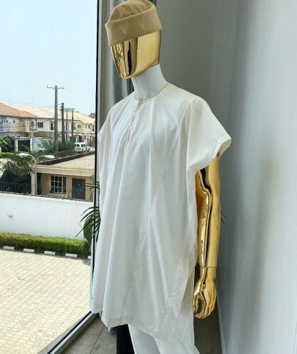 A Hand picked (jakan design) ivory white dashiki buba, sokoto & a cream patterned wool hat.