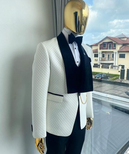 An Ivory white shawl lapel square pattern jacquard tuxedo suit.