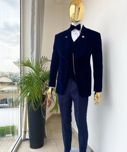 A midnight blue shawl lapel soaked velvet tuxedo suit