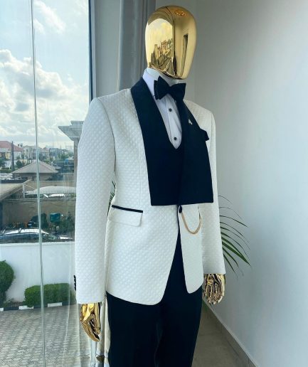 An Ivory white shawl lapel square pattern jacquard tuxedo suit.