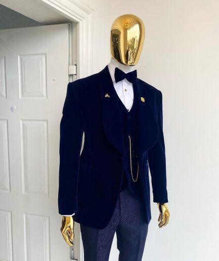 A midnight blue shawl lapel soaked velvet tuxedo suit