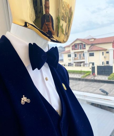 A midnight blue shawl lapel soaked velvet tuxedo suit