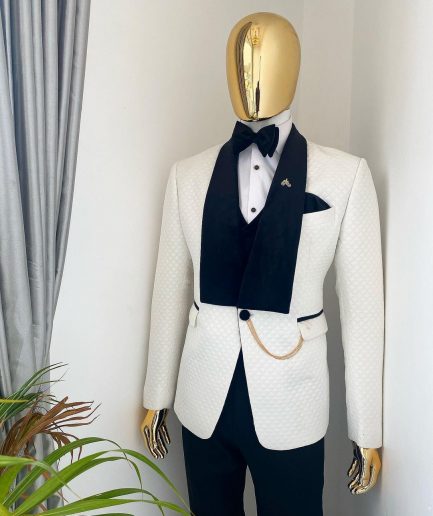 An Ivory white shawl lapel square pattern jacquard tuxedo suit.