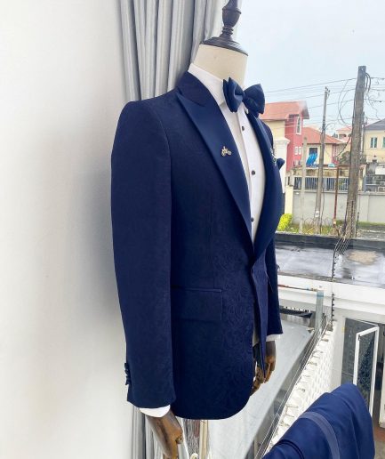 A midnight blue peak lapel floral jacquard tuxedo suit