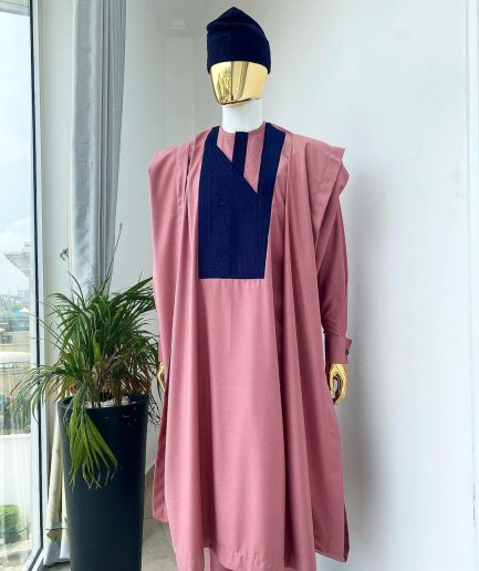 A light beige agbada with a navy blue uncoordinated lines embroidery design, Yoruba embroidery hat, kaftan and sokoto