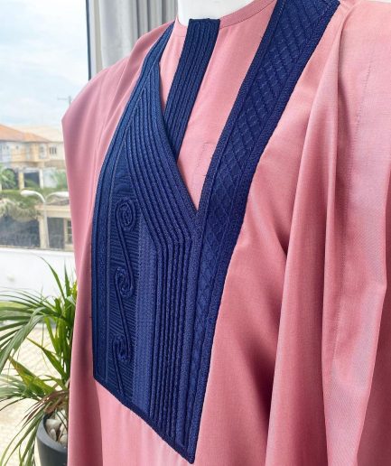 A light beige agbada with a navy blue uncoordinated lines embroidery design, Yoruba embroidery hat, kaftan and sokoto