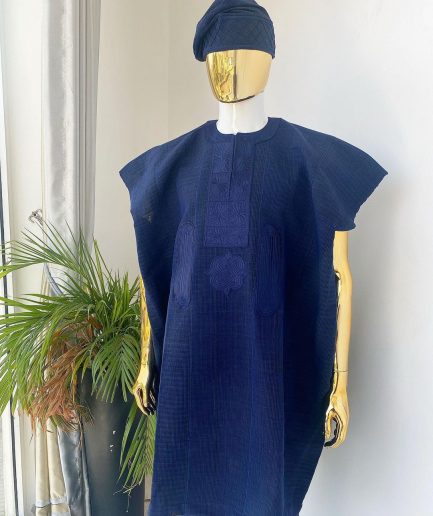 A navy blue aso oke dashiki with a floral and box-shaped embroidery design and hand-embroidered Yoruba hat
