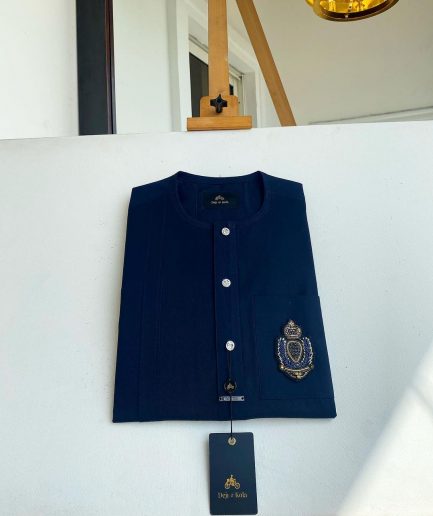A midnight blue, front flap, hand embroidery patch detailing, and Swarovski button African Kaftan