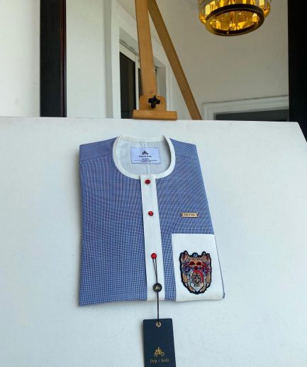 A Windowpane check blue and white mix front flap, hand embroidery patch detailing, and a red Swarovski African Kaftan and Sokoto