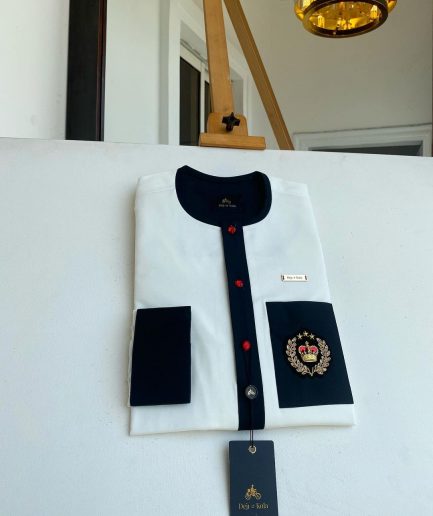 An Ivory white with a black flap, red detail button and royalty badge African Kaftan and Sokoto