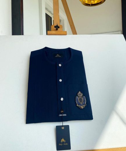 A midnight blue, front flap, hand embroidery patch detailing, and Swarovski button African Kaftan