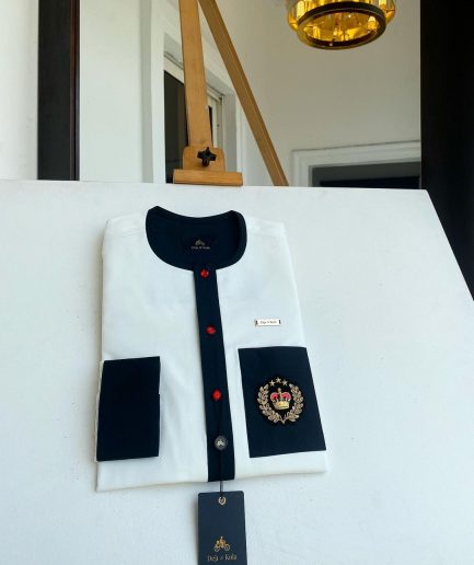 An Ivory white with a black flap, red detail button and royalty badge African Kaftan and Sokoto