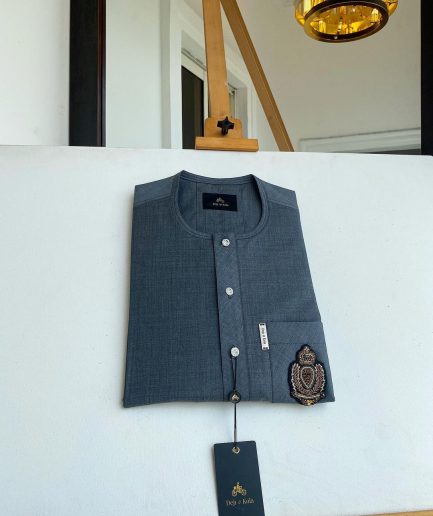 An Irish grey kaftan, button front flap, hand embroidery patch detailing, and a silver Swarovski African Kaftan and Sokoto