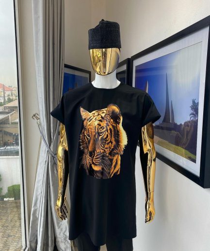 A charcoal black “daftan” with a tiger prints & black Fulani hat