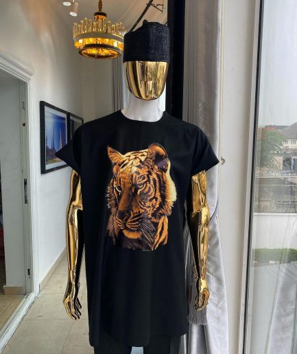 A charcoal black “daftan” with a tiger prints & black Fulani hat