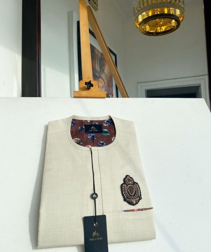 An Irish cream front flap and hand embroidery patch detailing African Kaftan sokoto