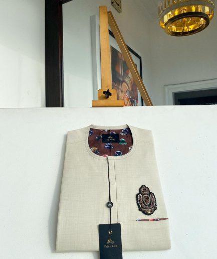 An Irish cream front flap and hand embroidery patch detailing African Kaftan sokoto