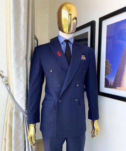 A Navy blue pinstripe double-breasted “Board Room” peak lapel suit