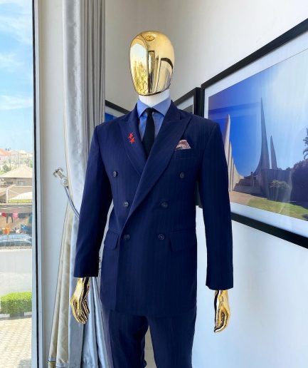 A Navy blue pinstripe double-breasted “Board Room” peak lapel suit