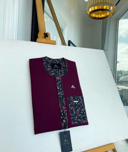 A Mulberry front flap with a clear view of a purple Swarovski button, a paisley-related purple flap and a pocket senator kaftan native