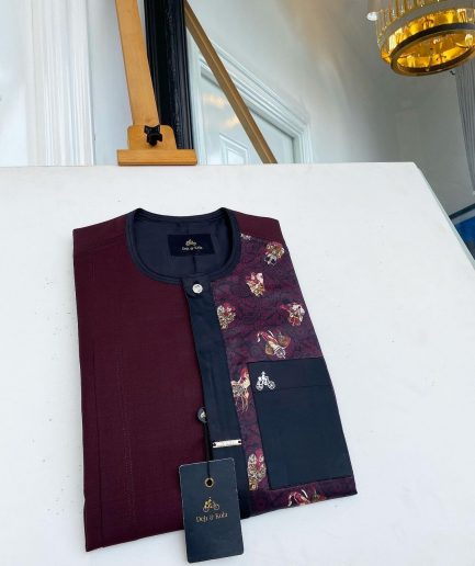 A sangria purple, front flap with silver clear view Swarovski button, half left section matching paisley senator kaftan native.