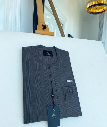 An invisible windowpane grey check, single pocket, front flap African traditional senator kaftan native.