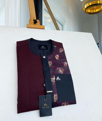 A sangria purple, front flap with silver clear view Swarovski button, half left section matching paisley senator kaftan native.