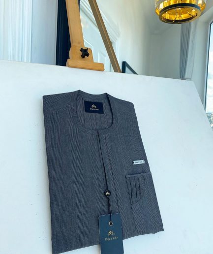 An invisible windowpane grey check, single pocket, front flap African traditional senator kaftan native.