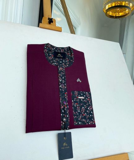 A Mulberry front flap with a clear view of a purple Swarovski button, a paisley-related purple flap and a pocket senator kaftan native