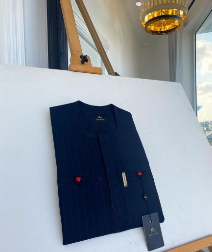 A pencil stripe midnight blue owl eye, double pocket, front flap African traditional senator kaftan native.