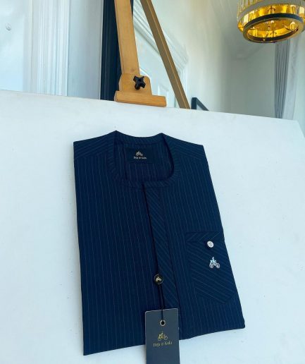A Navy blue pencil stripe combat pocket with a clear view Swarovski silver button, front flap African kaftan native