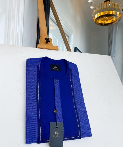 A related shade of blue rectangular front flap with clear view Swarovski button senator kaftan native