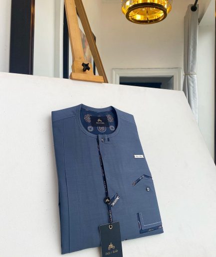 An air-force blue strap and roof pocket, single button front flap Kaftan