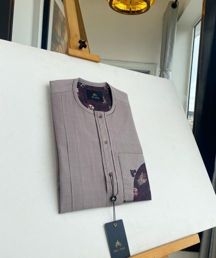 A liver brown, curved reverse pocket, front flap with purple Swarovski African kaftan native