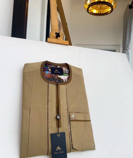 A Tortilla and brunette brown mix, patch pocket, and zipline flap detail African traditional senator kaftan native