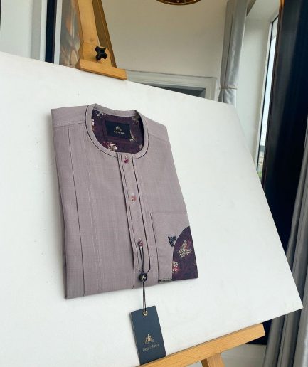 A liver brown, curved reverse pocket, front flap with purple Swarovski African kaftan native
