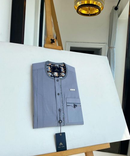 A cadet grey patch pocket and a front flap with a clear view of Swarovski button detail traditional Senator Kaftan native