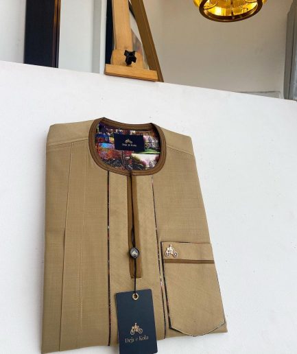 A Tortilla and brunette brown mix, patch pocket, and zipline flap detail African traditional senator kaftan native
