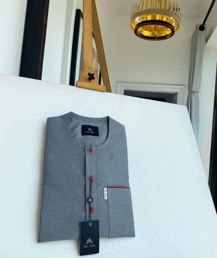 A grey, patch pocket and front flap with a clear view lipstick red Swarovski African kaftan