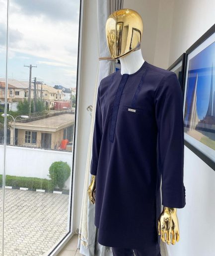 An eggplant purple “Suktan” shoulder drop embroidery and front flap, free suit hand sleeve details, African traditional senator native