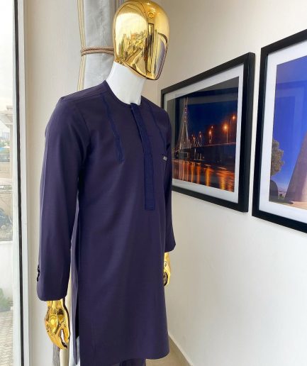 An eggplant purple “Suktan” shoulder drop embroidery and front flap, free suit hand sleeve details, African traditional senator native