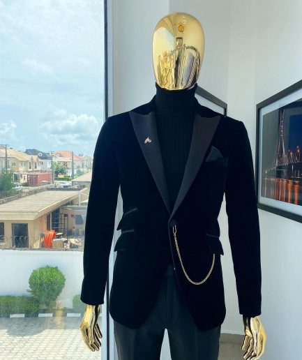 A charcoal black peak lapel soaked Italian velvet tuxedo suit