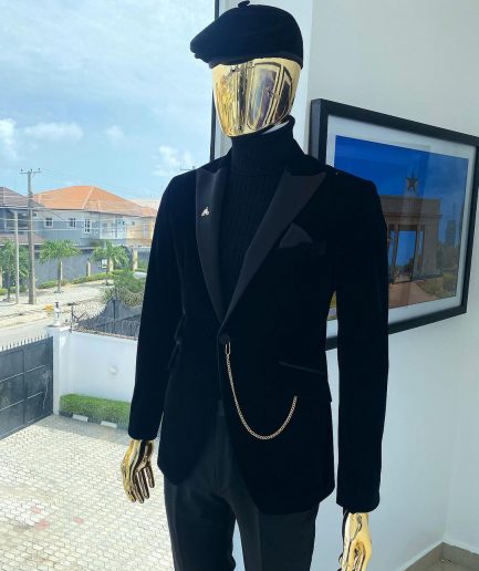 A charcoal black peak lapel-soaked Italian velvet tuxedo suit