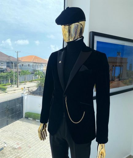 A charcoal black peak lapel-soaked Italian velvet tuxedo suit