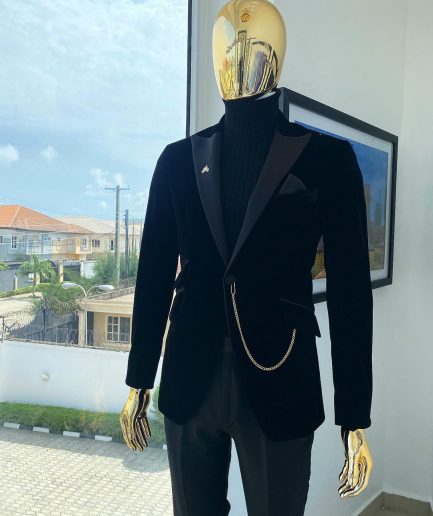 A charcoal black peak lapel soaked Italian velvet tuxedo suit