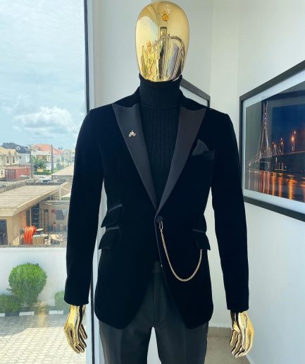 A charcoal black peak lapel soaked Italian velvet tuxedo suit