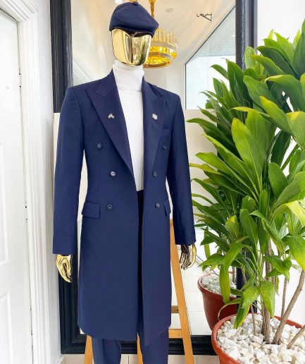 A reloaded “peaky Blinder” midnight blue peak lapel trench suit