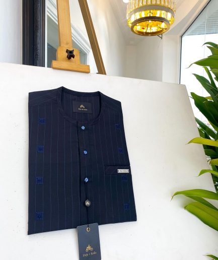 A midnight blue, light blue pencil stripe, clear view Swarovski buttons, horizontal line square embroidery details African traditional senator kaftan native.