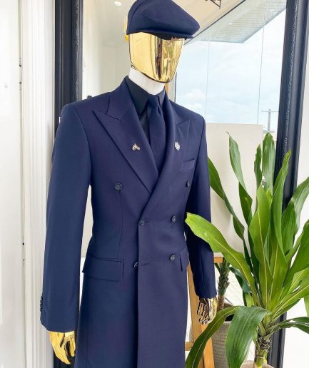 A reloaded monochrome “peaky Blinder” midnight blue peak lapel trench suit